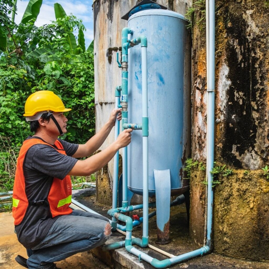 plumber working on water heater